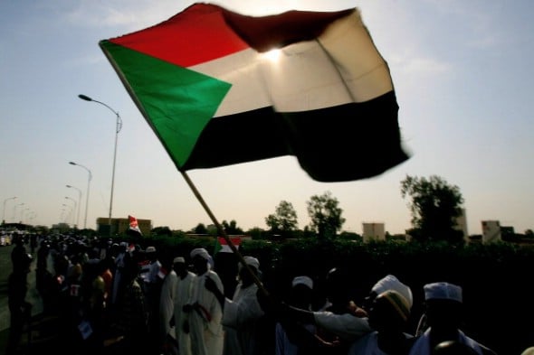 The Sudanese flag waves in the sun