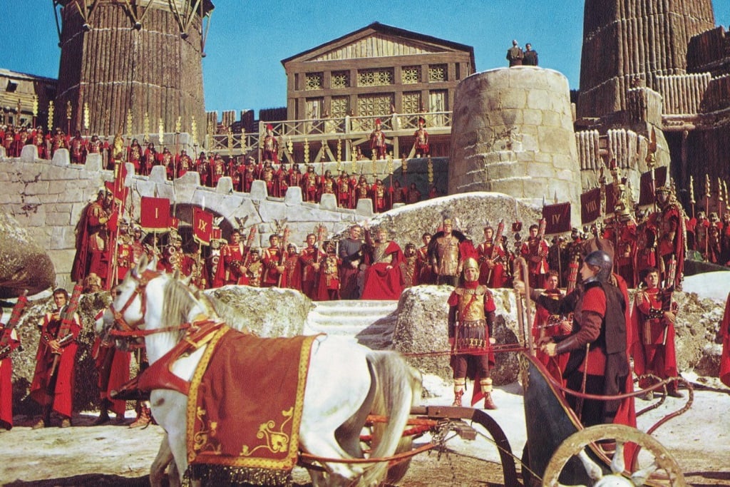 Roman soldiers gather on the steps of a building in The Fall of the Roman Empire