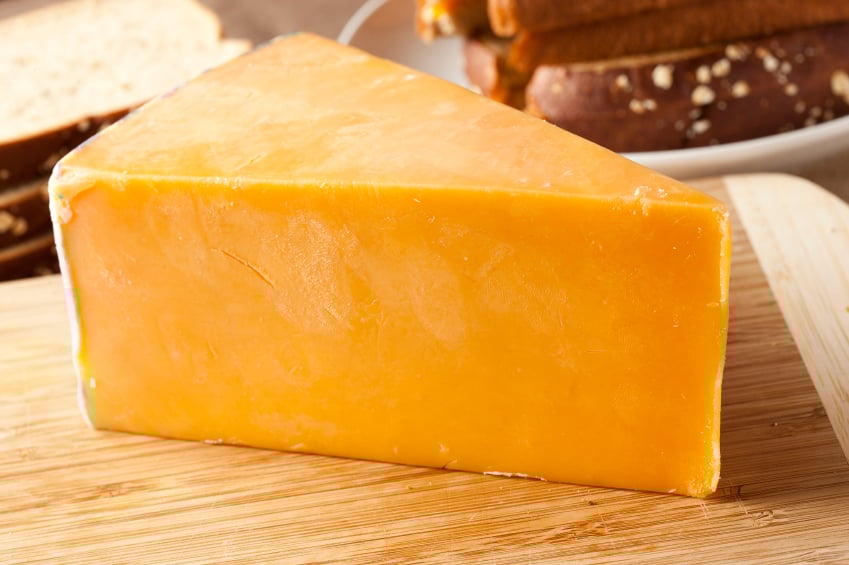 Large block of cheddar cheese