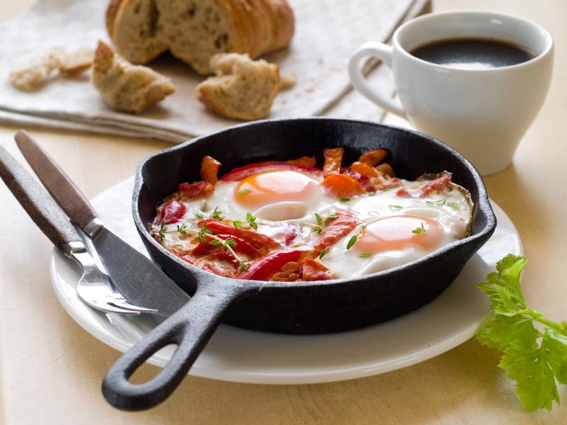 Middle Eastern breakfast called shakshuka with eggs, tomatoes, and peppers