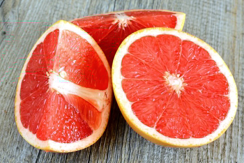 Grapefruit segments on a wooden table