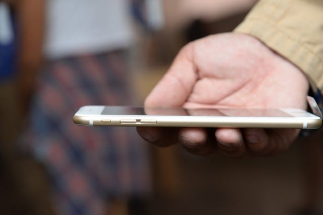 Tony Zhan checks out his new iPhone 6 Plus outside the Apple store in Pasadena, California on the first day of sale, September 19, 2014.