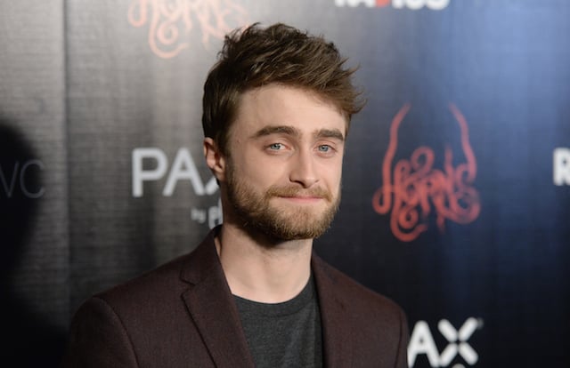 Daniel Radcliffe poses on the red carpet at the Horns premiere