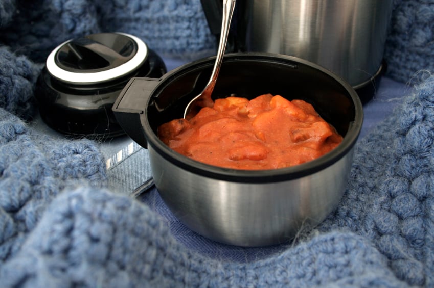 Stew in a thermos with a spoon