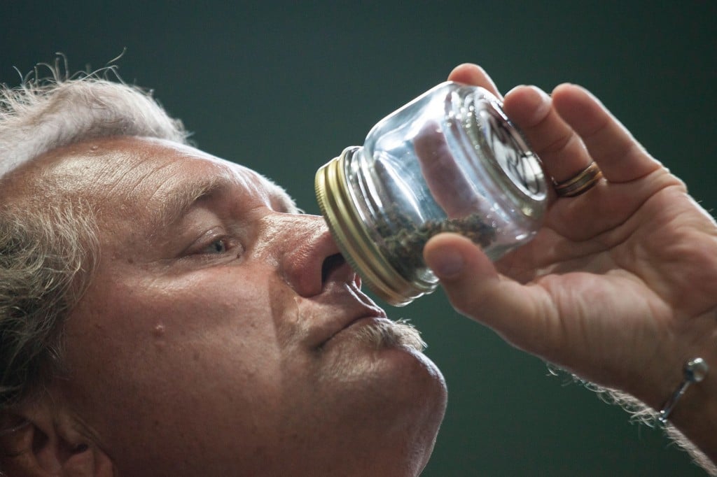 man sniffing marijuana product