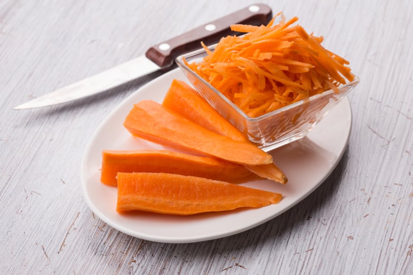 Grated carrots on board