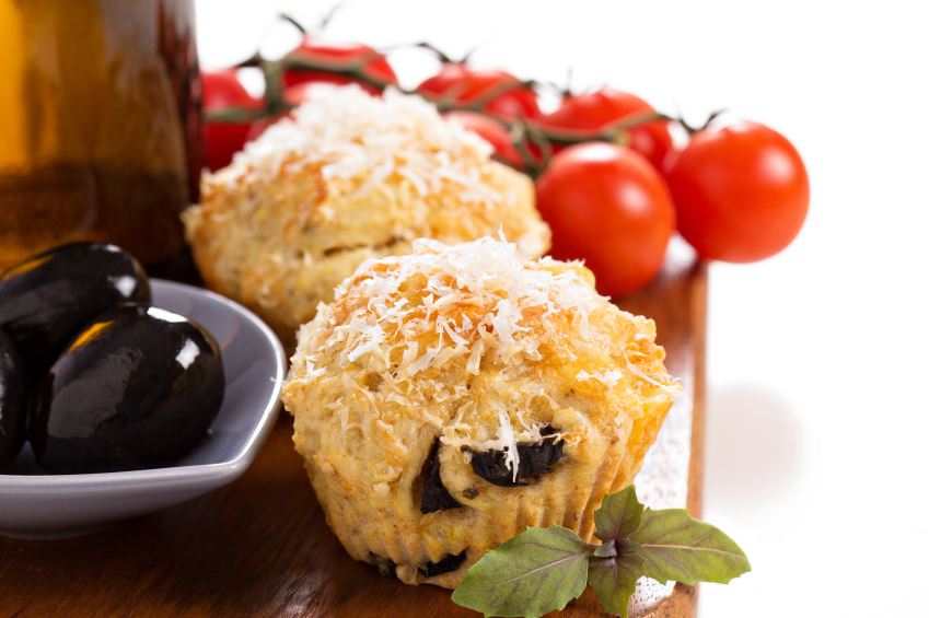 olive chia muffins with tomatoes and oil in background