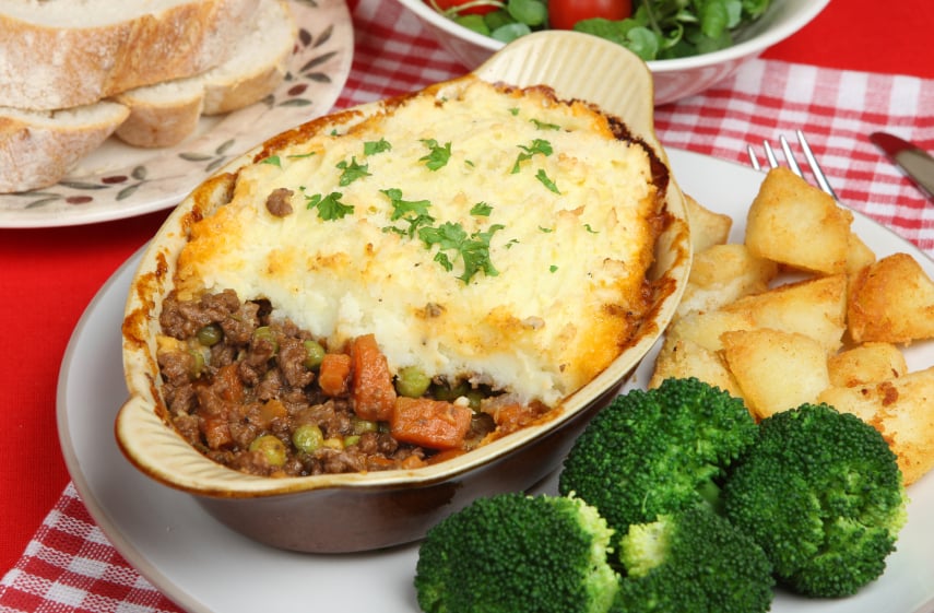 hearty shepherd's pie with carrots, peas, and mashed potatoes