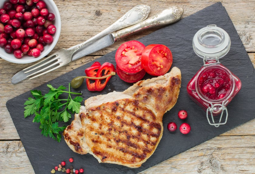 grilled pork chops with cranberries and tomatoes