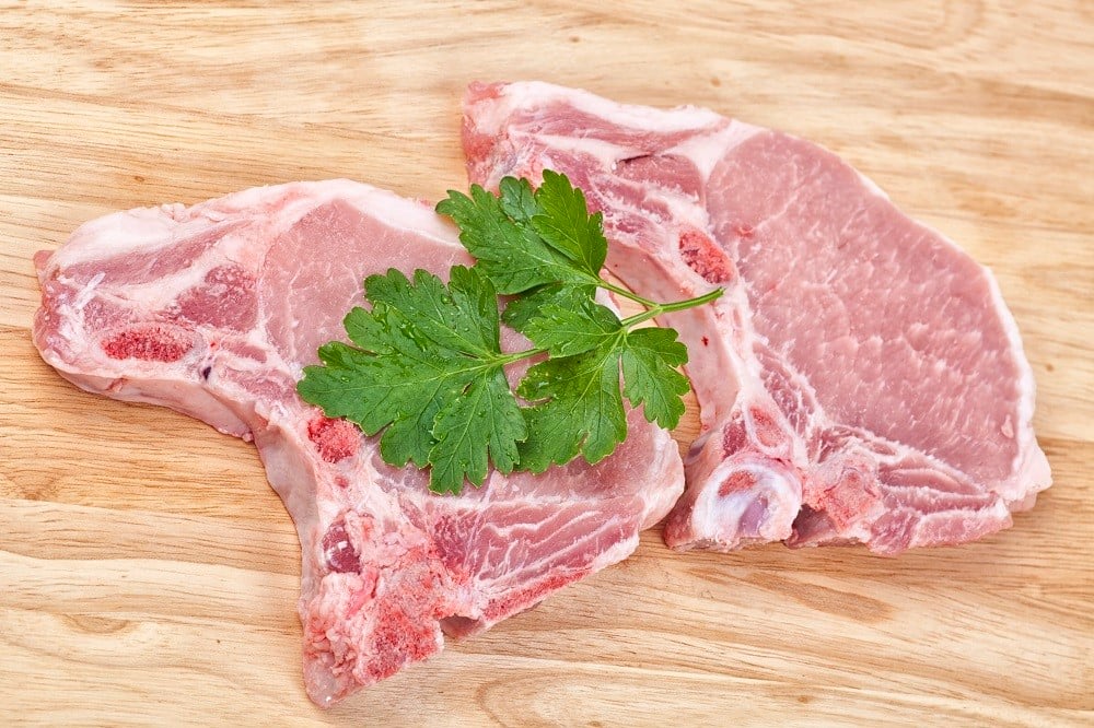 raw pork chops with parsley 
