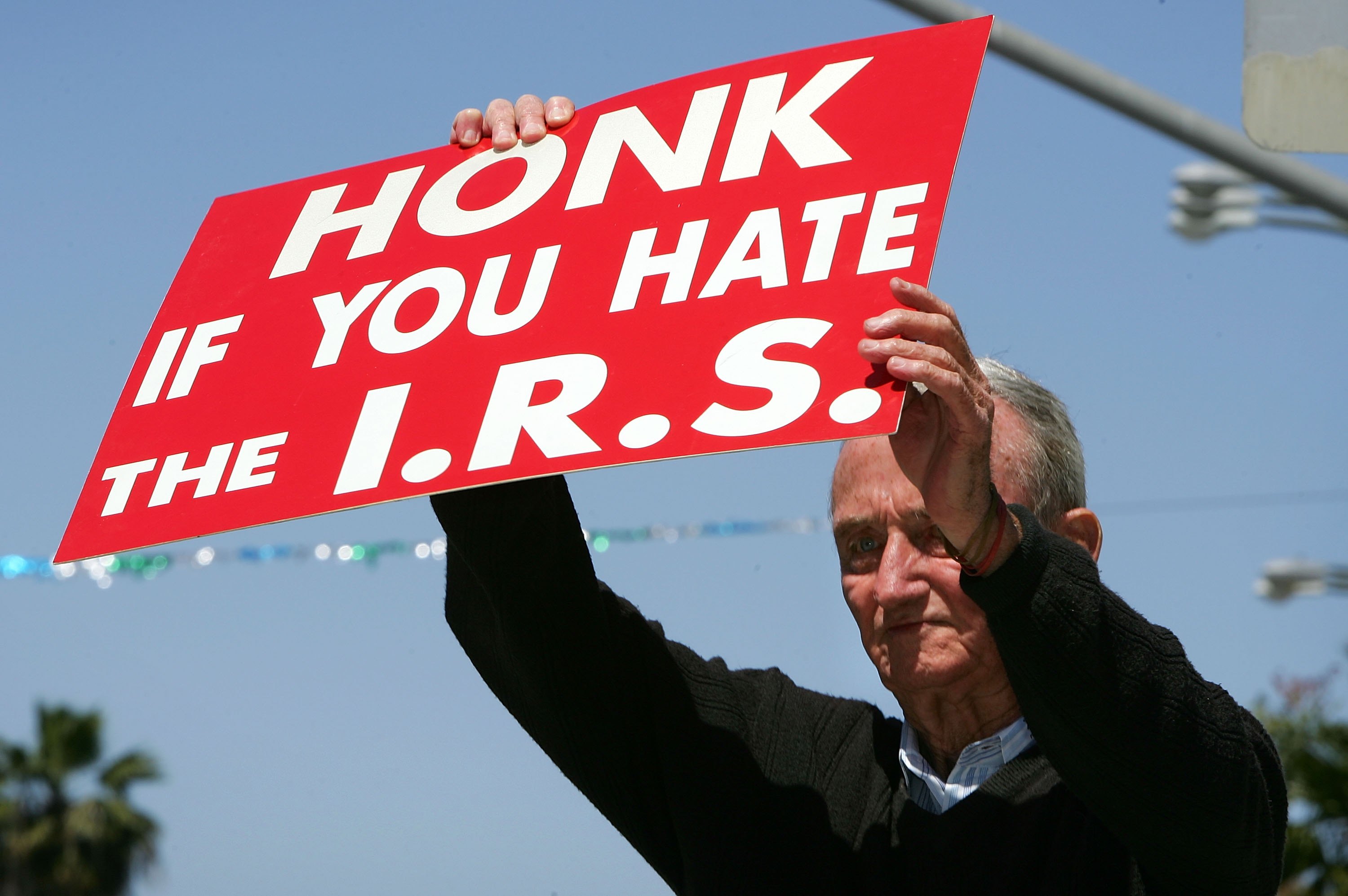 Man holding anti-IRS sign