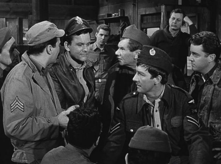 A group of World War II soldiers talk in a scene from Hogan’s Heroes