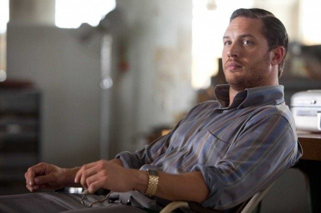 Tom Hardy leads back in a desk chair