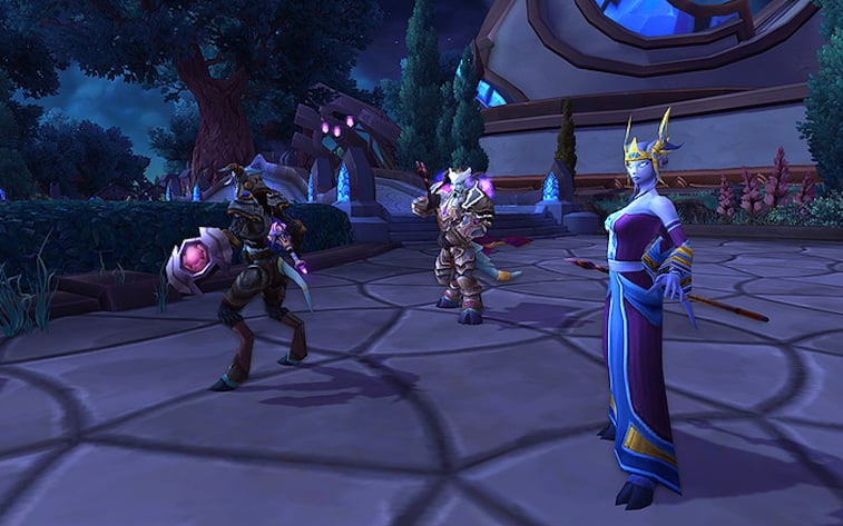 Elves and dwarfs stand in a lobby in World of Warcraft.
