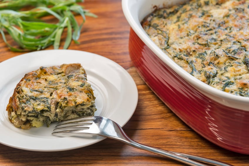 egg and pianch casserole baked in a ceramic dish