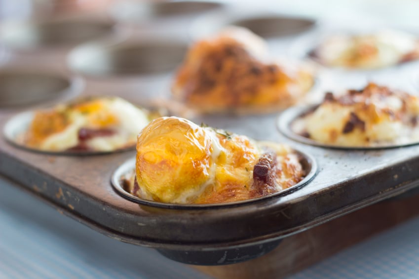 baked eggs and sausage in a muffin tin