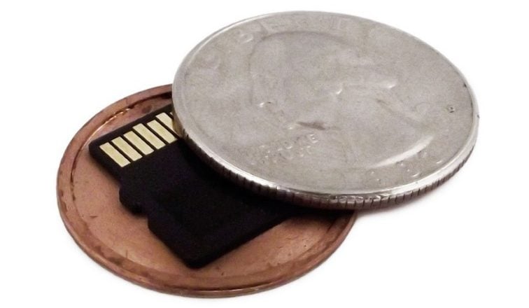 MicroSD card hidden in a coin-shaped case