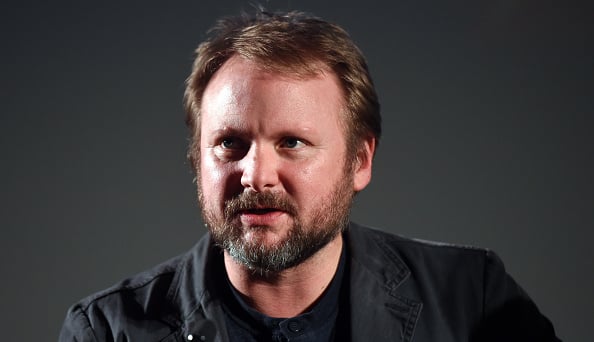 A press photo of Rian Johnson, glancing to the left of the frame