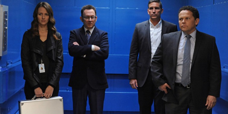 The cast stand together in a scene from Person of Interest 