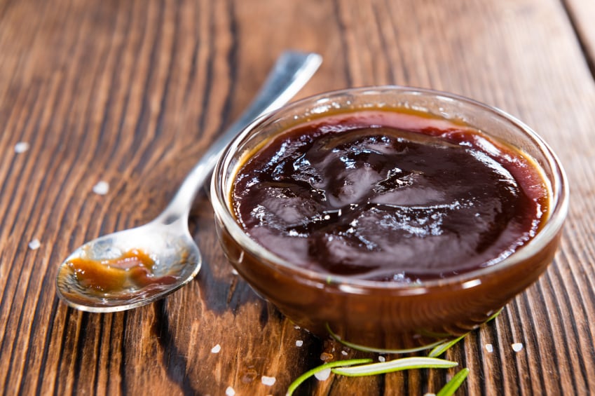 small glass dish filled with barbecue sauce