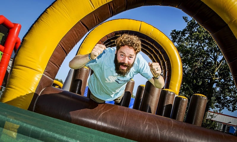 Man jumping on inflatables