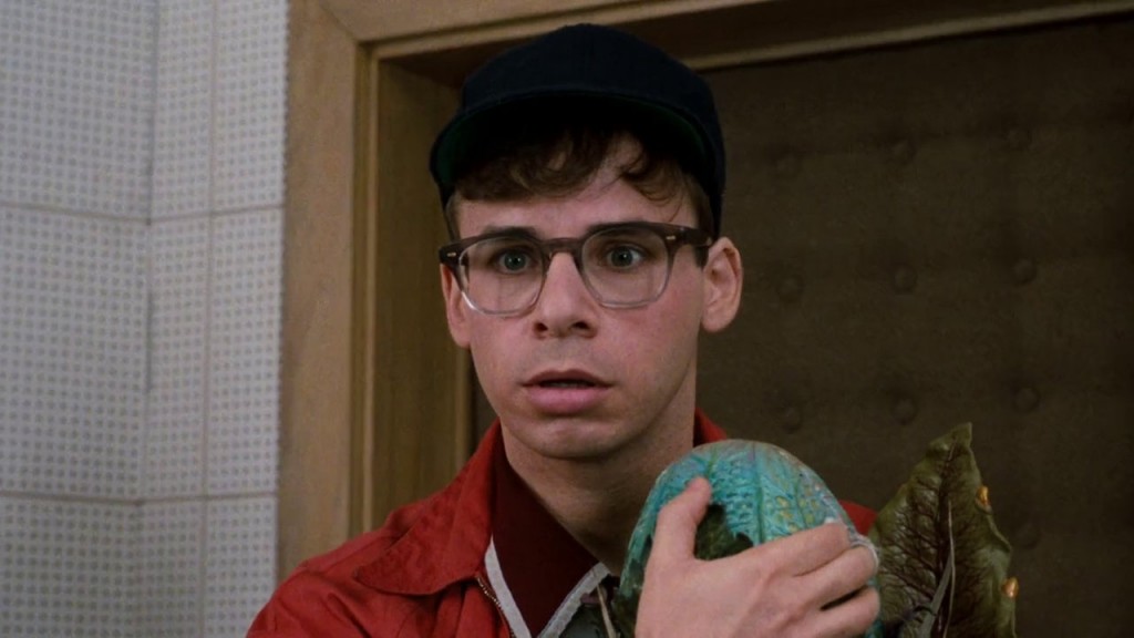 Rick Moranis looks shocked in Little Shop of Horrors.