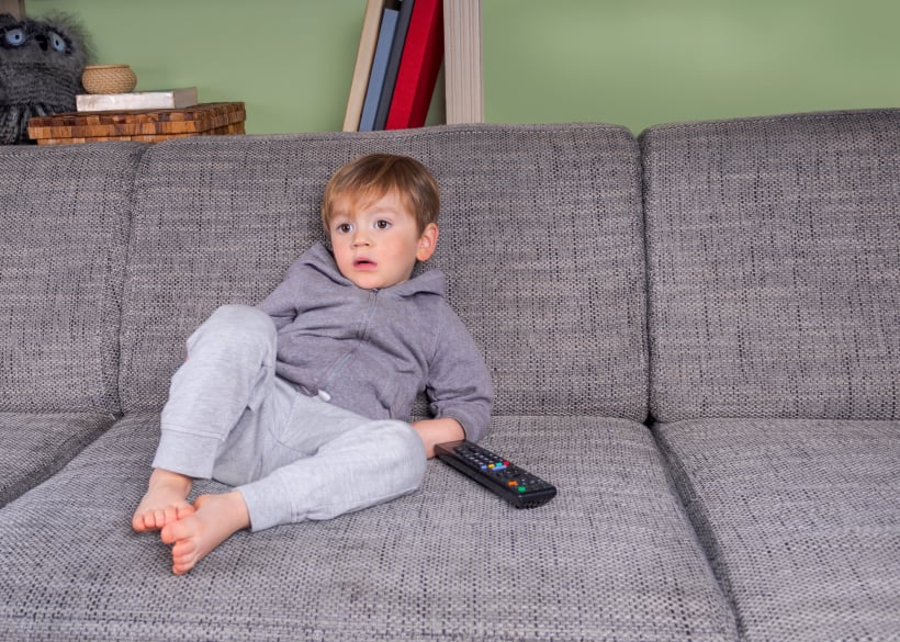 toddler sitting on a couch