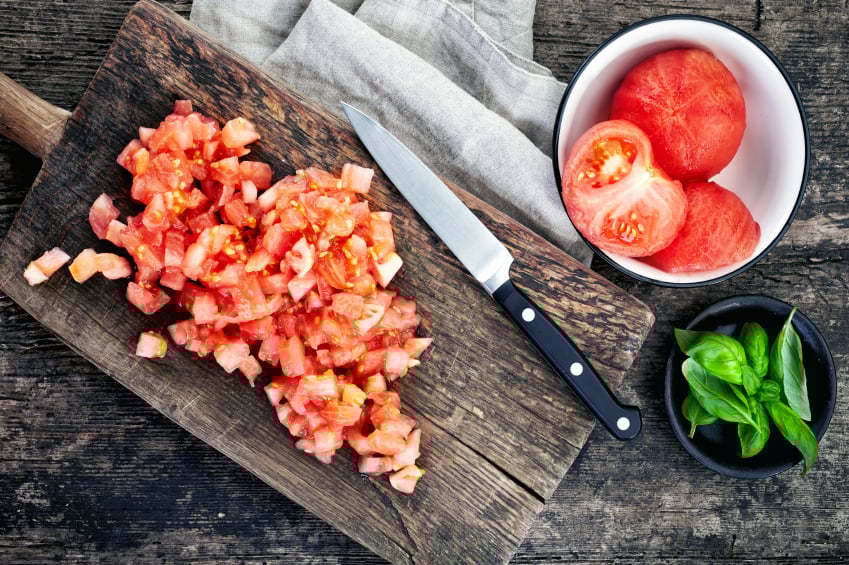 chopping tomatoes