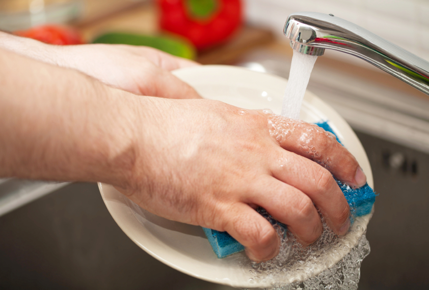 A man washes the dishes