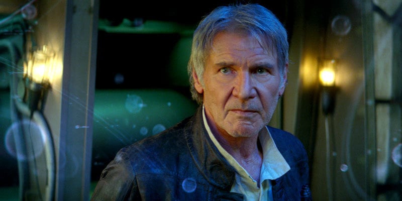 An older Han Solo looks concerned, glancing to the left of the frame