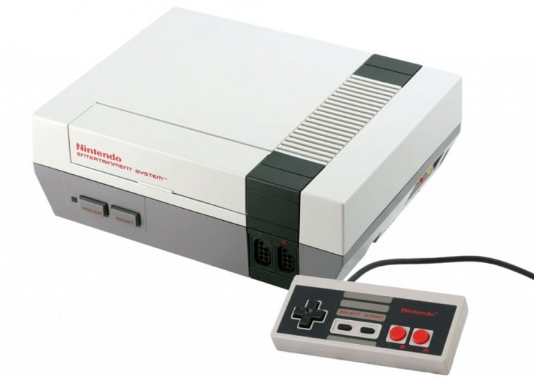 A Nintendo Entertainment System and controller on a white background.
