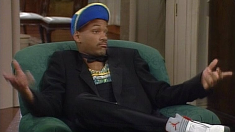 Will Smith as The Fresh prince, sitting on a couch and shrugging