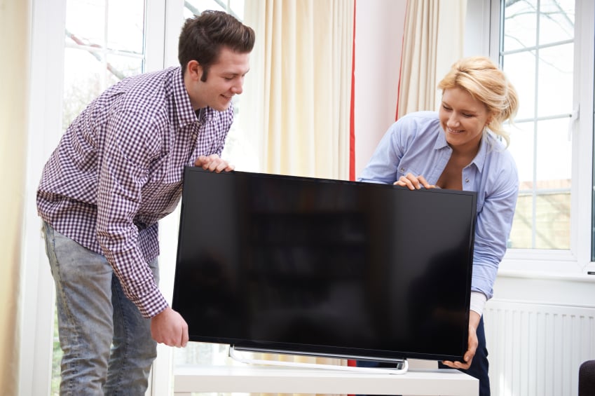 couple moving TV