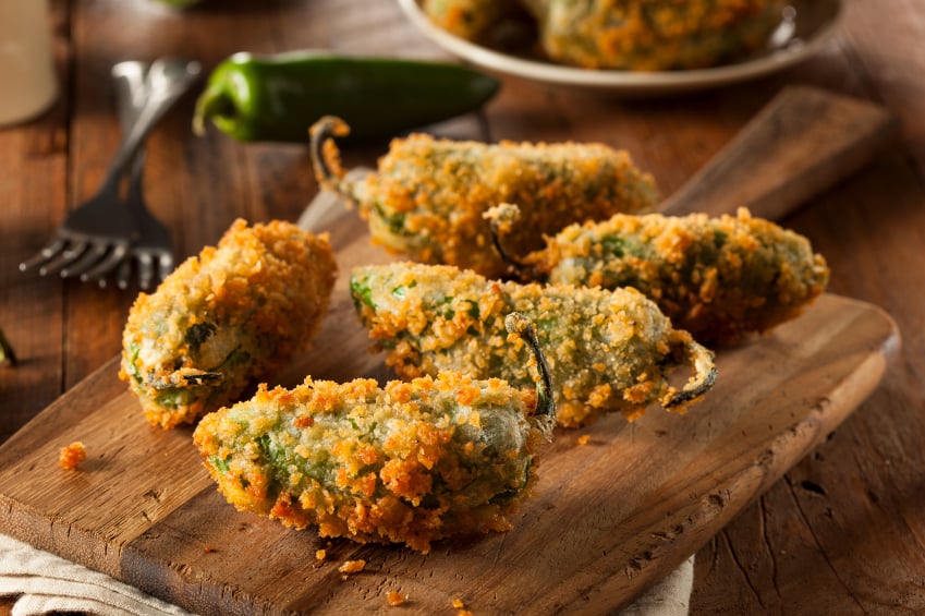 Breaded Jalapeno Poppers on wooden tray