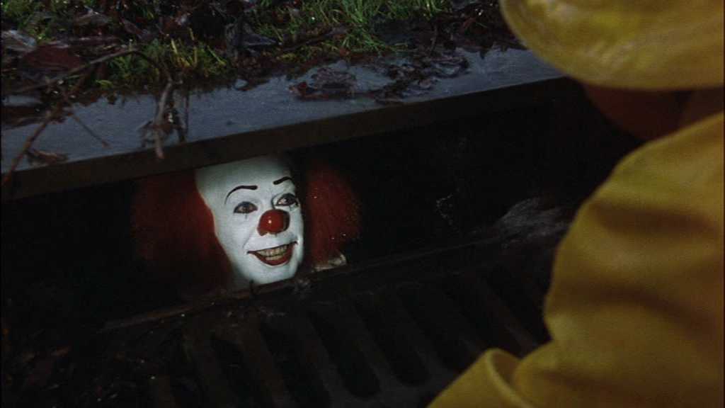Tim Curry as Pennywise in Stephen King's IT