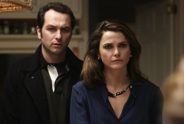 Keri Russell stands in front of Matthew Rhys in a scene from The Americans