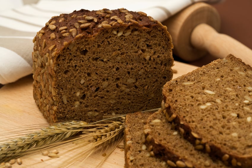 whole-grain bread slices with blades of wheat