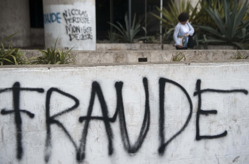 Graffiti saying "fraude" is seen in Venezuela