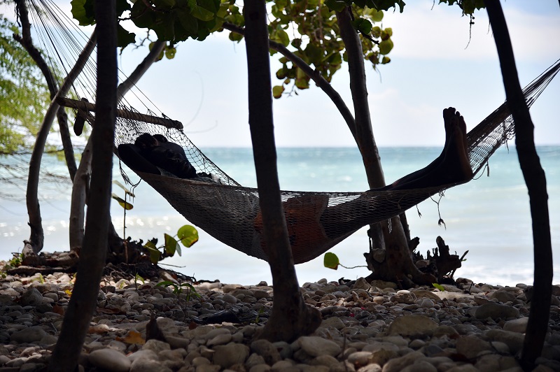 Man relaxing in a hammock in Haiti 
