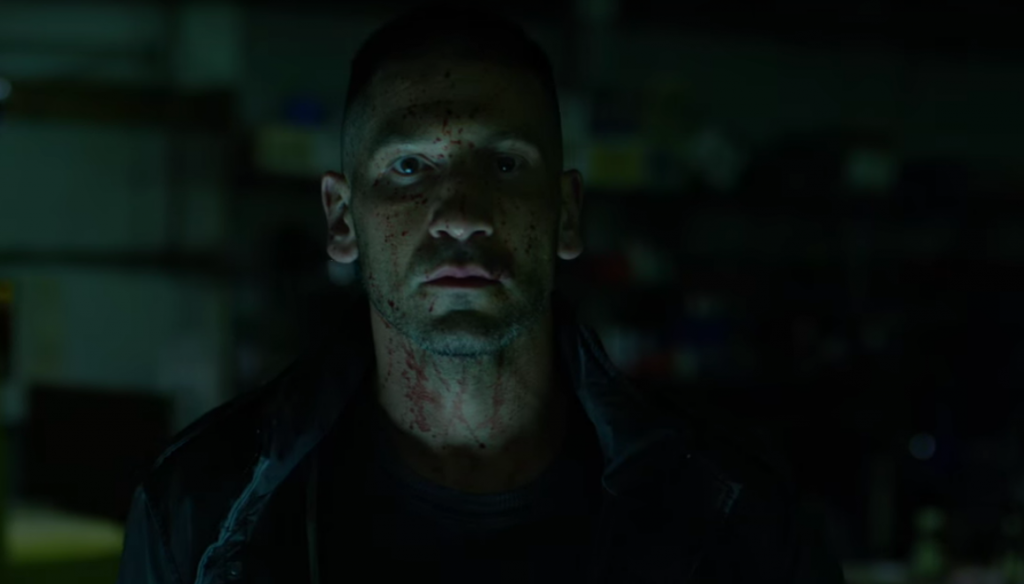 Actor Jon Bernthal's face splattered with blood as he stares into the camera