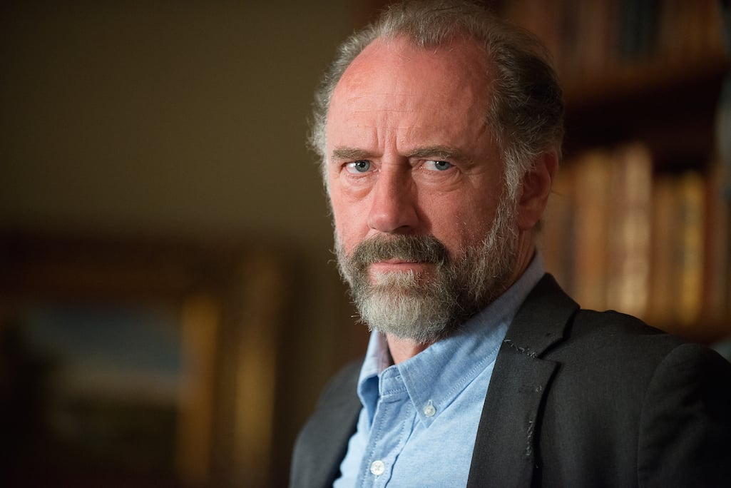 Gregory looks stern in a scene from 'The Walking Dead'