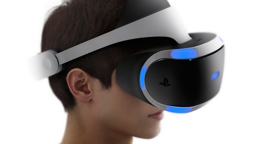A man wears a PlayStation VR headset on a white backdrop.