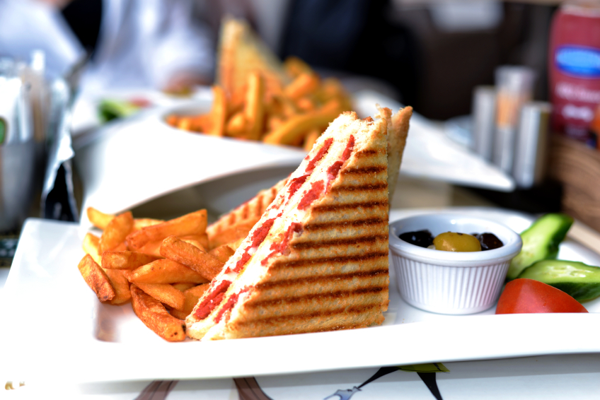 grilled cheese sandwich with pepperoni or other sausage cut in half and served with with french fries