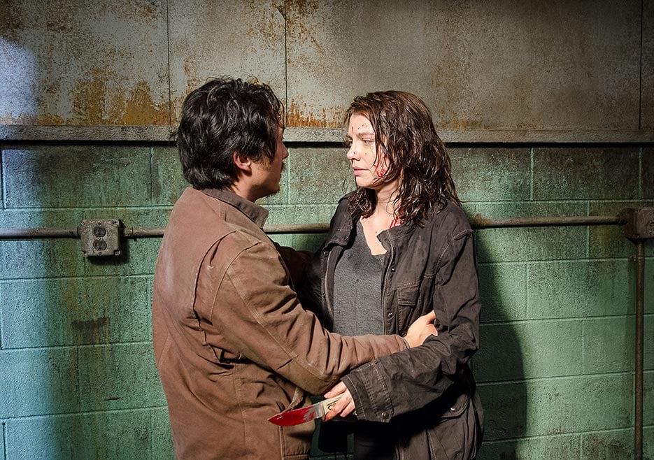 Glenn (Steven Yeun) embraces Maggie (Lauren Cohan) in a scene from Season 6 of AMC's 'The Walking Dead'