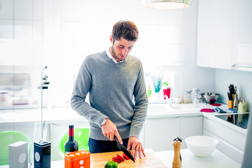 A man, likely concerned about diabetes, cooks at home