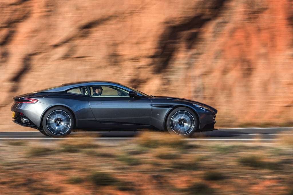 Aston Martin DB11 speeding down the road.