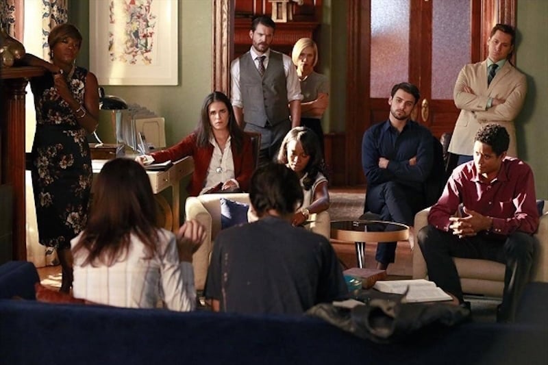 The cast of How to Get Away with Murder sits around a living room