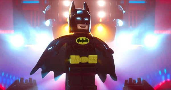Batman looks happy during a scene from 'The LEGO Batman Movie'