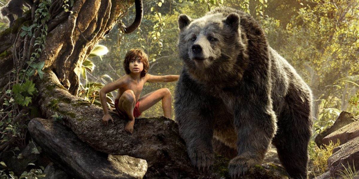 Mowgli and Baloo sitting on a tree in the jungle