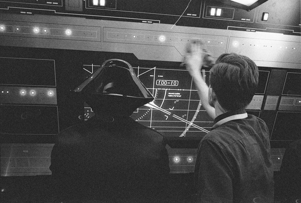 Rian Johnson wiping down a control panel